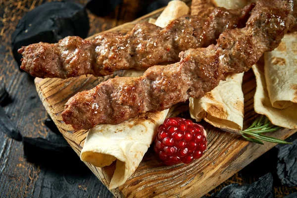 stock image Lamb Lyulya kebab with pita on wooden board. Turkish food