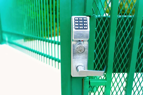 Pin code entry gate lock close-up outdoors
