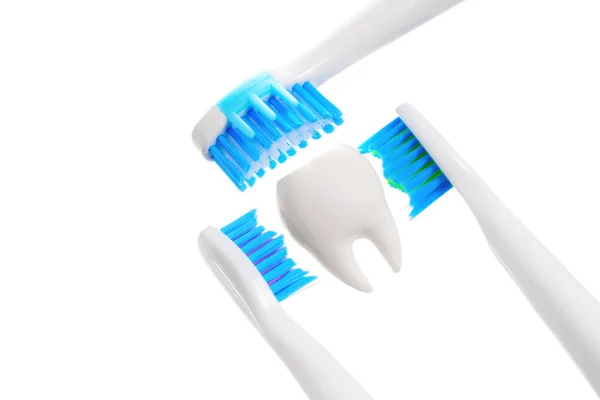 Close View Three Electric Toothbrushes Framing Tooth Model Isolated White — Stock Photo, Image