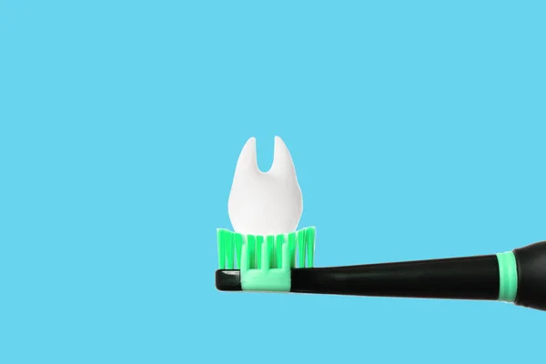 Large Tooth Model Placed Top Black Electrical Toothbrush Green Bristles — Stock Photo, Image