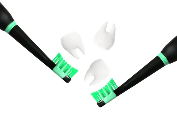 Close View Two Black Electric Toothbrushes Green Bristles Three White — Stock Photo, Image
