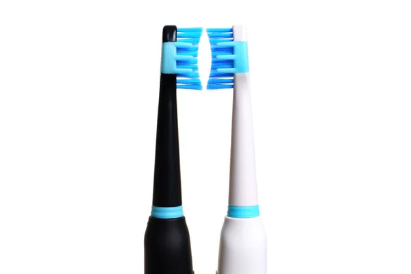 Two Electric Toothbrushes One Black One White Blue Bristles Facing — Stock Photo, Image