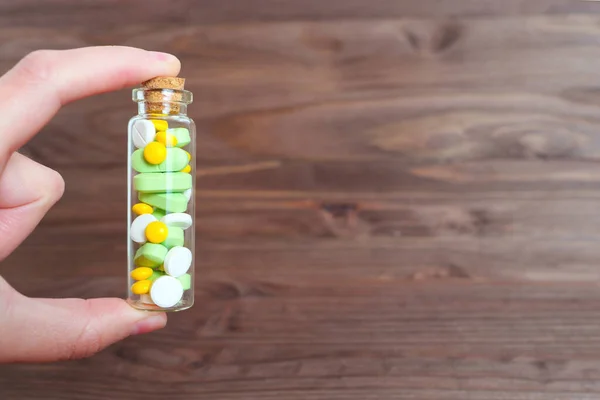Prescription Medication Close Hand Holding Small Glass Pill Bottle Full — Stock Photo, Image