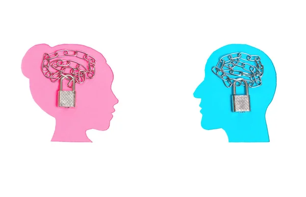 Pink and blue female and male head profile paper cutouts on white with chained padlocks symbolically placed inside the brain area of each face.