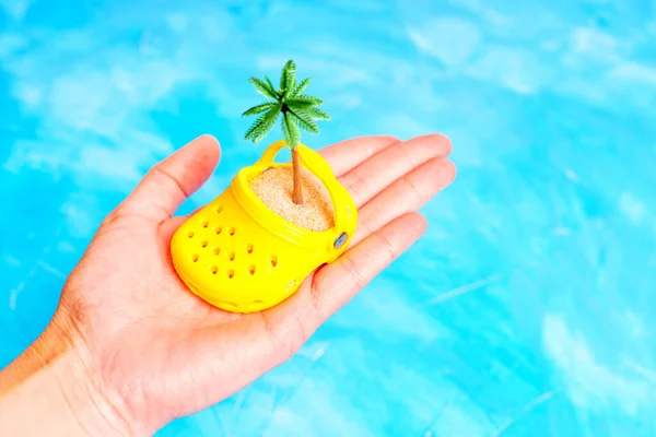 Hand Holding Tiny Yellow Clogs Shoe Filled Sand Toy Palm — Stock Photo, Image