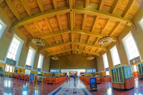 Stock image Los Angeles, California - April 12, 2024: Interior view of the Union Station's grand hall with a high ceiling adorned with intricate patterns and large chandeliers