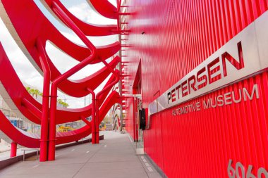Los Angeles, California - April 4, 2024: Detailed view of the facade design of the Petersen Automotive Museum, showcasing its unique architectural features. clipart
