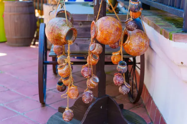 stock image San Diego, California - April 16, 2024: Hanging Clay Pots on Display in Old Town Historic Park