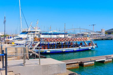 Barcelona, Spain - July 16, 2024: Tourist Boat At Barcelona Port With Docking Facilities clipart