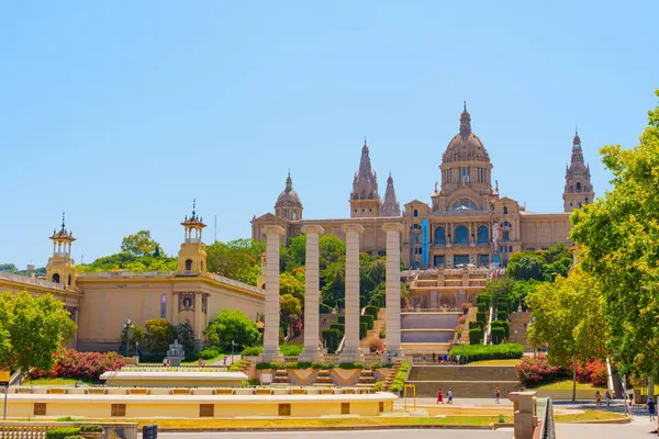 stock image Barcelona, Spain - July 16, 2024: Elegant View Of Four Columns, Magic Fountain and Palau Nacional In Barcelona