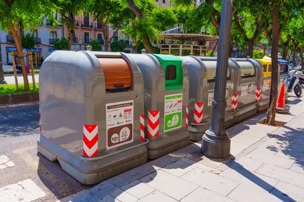 stock image Tarragona, Spain - July 15, 2024: Colorful Recycling Bins in Tarragona's Street Scene