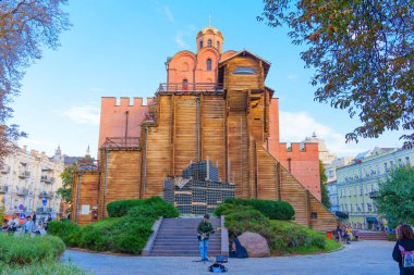 Kyiv, Ukraine - October 9, 2024: Musician Playing Guitar Near Golden Gate Fortress in Kyiv clipart