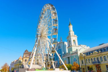 Kyiv, Ukraine - October 9, 2024: Ferris Wheel and Clock Tower at Kontraktova Square in Kyiv clipart