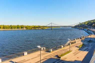 Kyiv, Ukraine - October 9, 2024: View from Poshtova Square of Pedestrian Bridge to Trukhaniv Island clipart