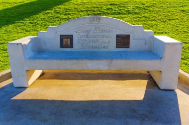 Long Beach, California - January 15, 2025: Audrey Hauth and ICB Marathon Commemorative Bench at Long Beach, California clipart