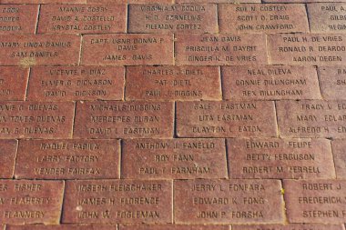 Long Beach, California - January 15, 2025: Engraved Bricks with Names at Long Beach Naval Memorial clipart