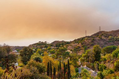 Los Angeles, California - January 8, 2025: California Hills with Smoke-Laden Sky clipart