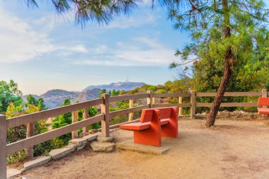 Los Angeles, California - December 14, 2024: Viewpoint with Benches Overlooking Griffith Park and Hollywood Sign clipart