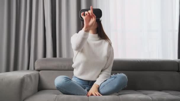 Happy Woman Glasses Moves Hand Sitting Comfortable Couch Apartment Living — Vídeo de stock