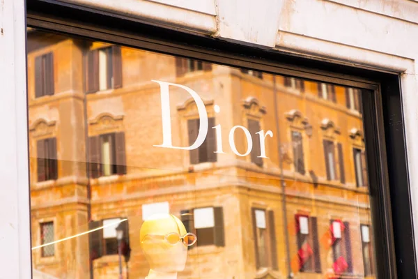 Stock image Amazing Dior store window with a reflection of house in Rome. Fashion week concept. March 2023, Rome, Italy.