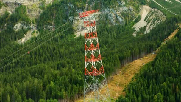 High Voltage Electric Transmission Tower Mountains Surrounded Trees Aerial View — Stock Video
