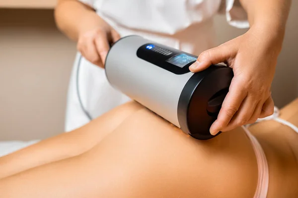 LPG anti-cellulite massage of hips in beauty salon