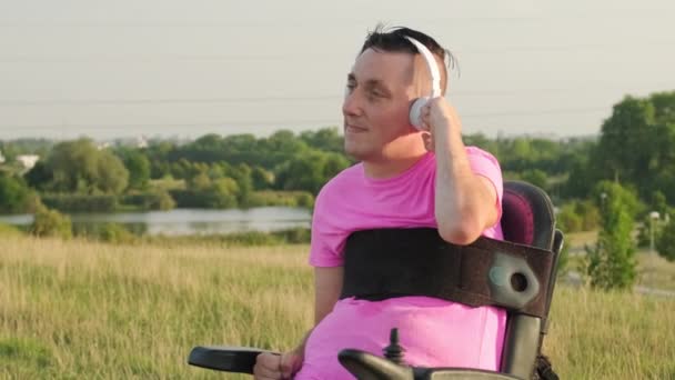 Man Wheelchair Back Injury Listens Favourite Music White Headphones Male — Stock Video