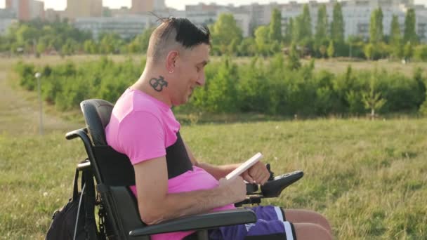 Homosexual Man Wheelchair Holds Cell Phone Injured Hands Making Video — Stock Video