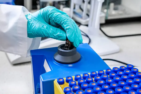 stock image Samples are shaken by a chemist with a vortex mixer before HPLC analysis