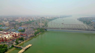 Aerial view of Howrah Bridge, This is a balanced steel bridge over the Hooghly River in West Bengal, India. clipart