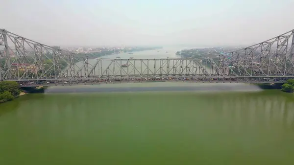 stock image Aerial view of Howrah Bridge, This is a balanced steel bridge over the Hooghly River in West Bengal, India.