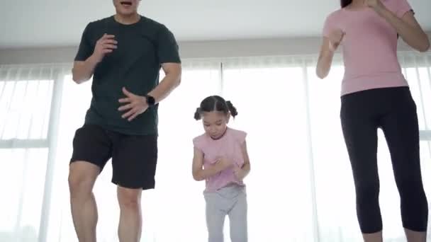 Cheerful Happy Asian Family Father Mother Daughter Making Home Exercise — Wideo stockowe