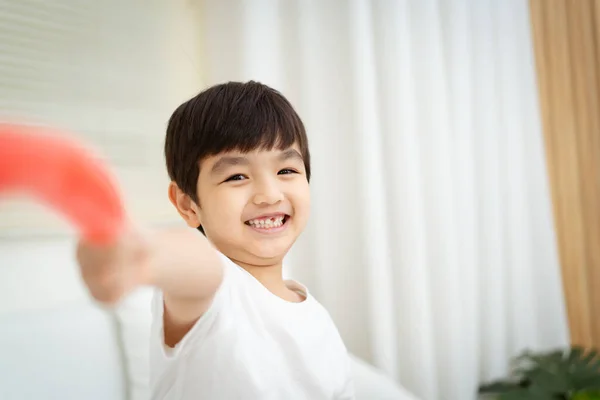 Happy Cheerful Asian Little Young Boy Sits Sofa Plays Camera — Stock Photo, Image
