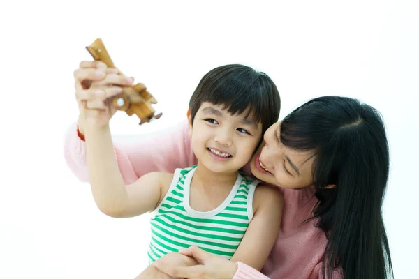 Happy Asian Little Boy Playing Wooden Airplane Toy His Mother — стоковое фото