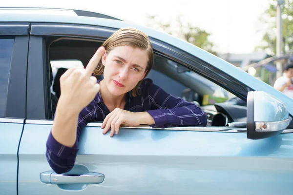 Aggressive Young Female Driver Showing Middle Finger Other People While — Stock Photo, Image
