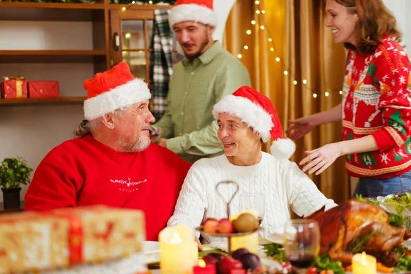 Happy - cheerful caucasian white family enjoy the time to celebrating the Christmas Eve and New Year festival together, caucasian white people family cheers a wine together in Christmas party.