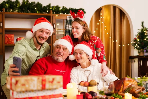 Happy - cheerful caucasian white family enjoy the time to celebrating the Christmas Eve and New Year festival together, caucasian white people family cheers a wine together in Christmas party.