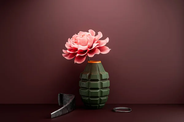 The flower in the disassembled hand grenade - anti-war concept. 3d illustration of the vase for flowers made of bomb weapon with ring and lever
