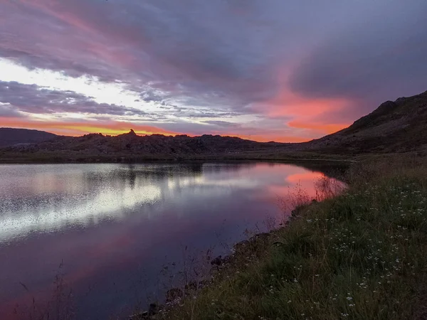 stock image Sunset reflected in a lake on Mageroya Island in Norway