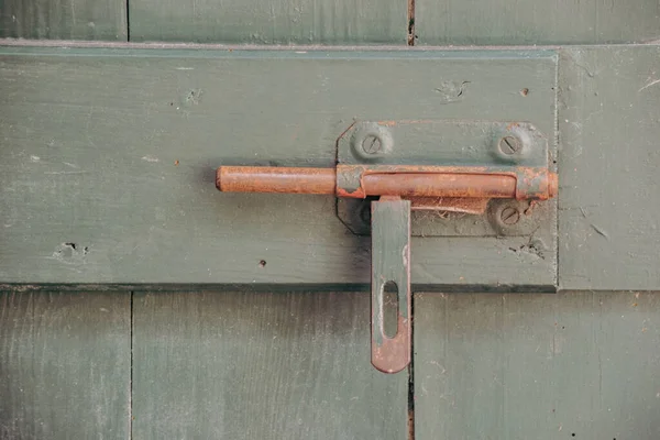 rusty lock on an old gate