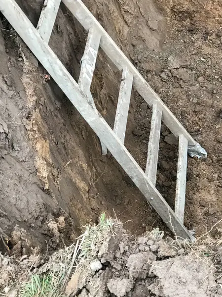 stock image ladder to go down into the well at the construction site