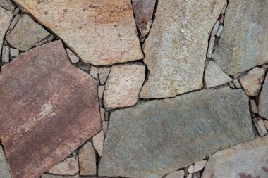 Duvarı kaplayan bir taşın arka planı