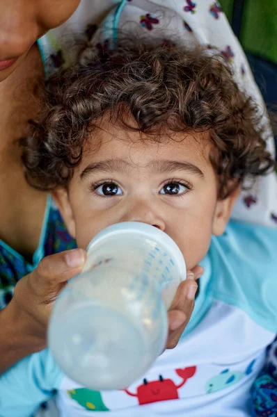 Stock image a boy with a bottle of water