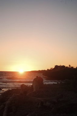 beautiful sunset over the beach in the ocean.