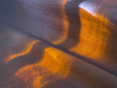 Turuncu ışık ile soyut örgü dokusu