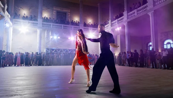 stock image Couple dancers perform latin dance on large professional stage. 