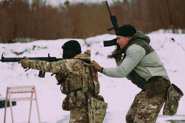 Military training. Couple training in tactical shooting.