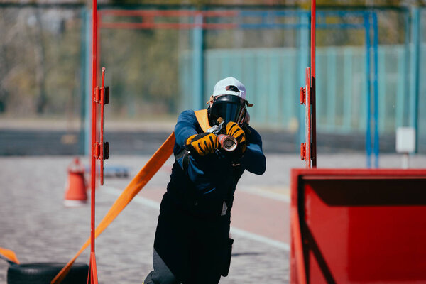 Brave Firefighter Training Hose Sports Ground Stock Picture