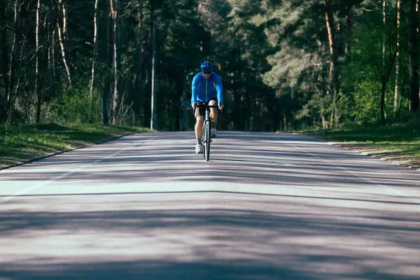 Young Man Riding Bike Road Forest Stock Image