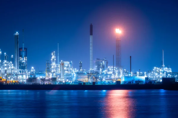 View of the plant at night. Industrial landscape. Production. Heavy industry. Processing of oil and gas.  Industrial area in the evening.